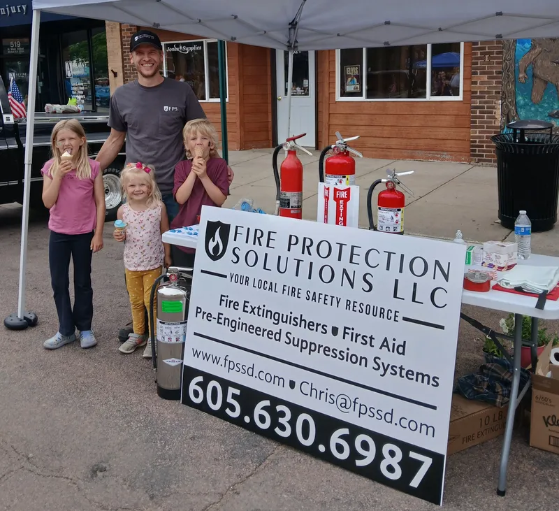 Fire Protection Solutions community outreach booth at Mitchell First Fridays on Main